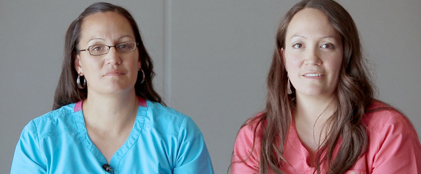 Two islander nurses smiling into camera